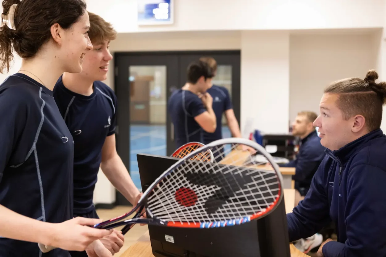 Students going to play tennis at the sports centre