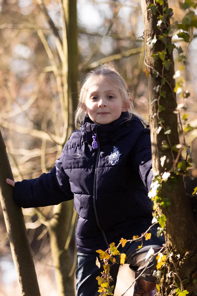 Clayesmore School student in a tree