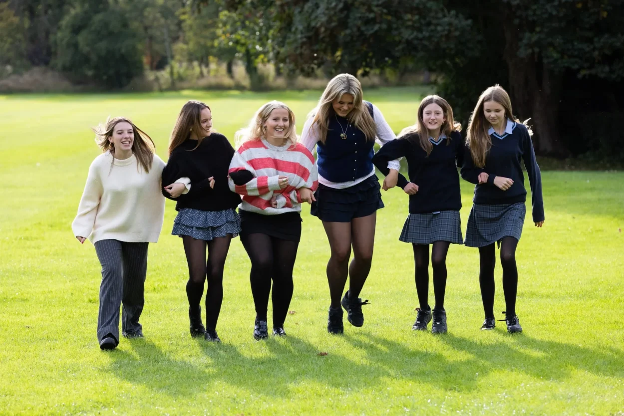 Boarders walking on the lawn