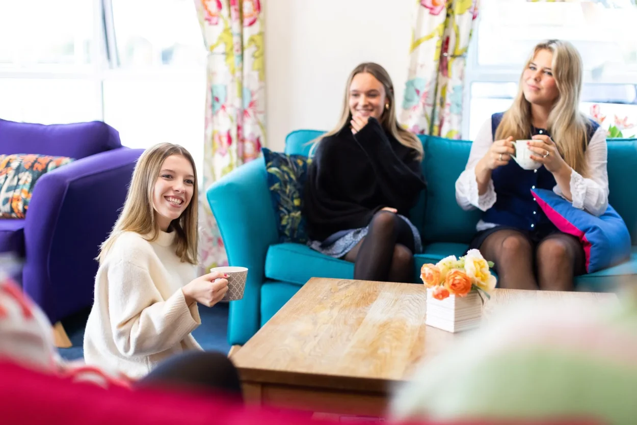 Boarders having tea in the common room