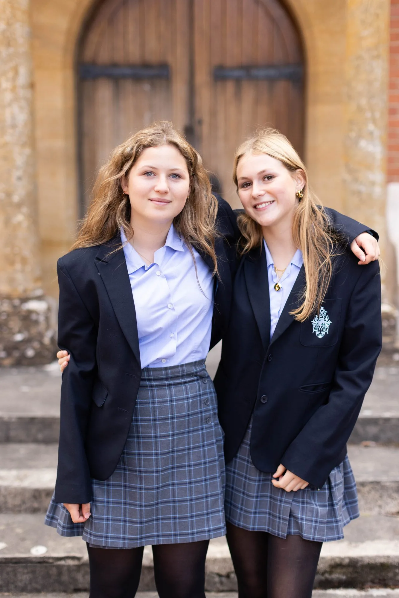 Two pupils outside the main entrance