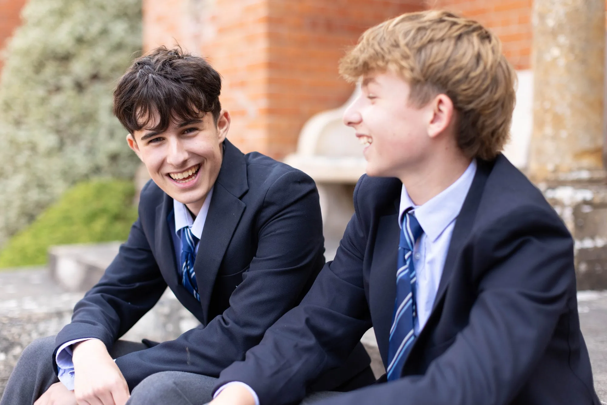 Two pupils chatting outside