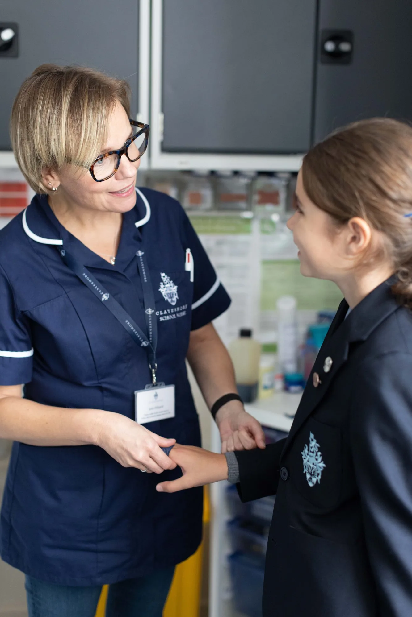 A nurse talking with a pupil in the Medical Centre