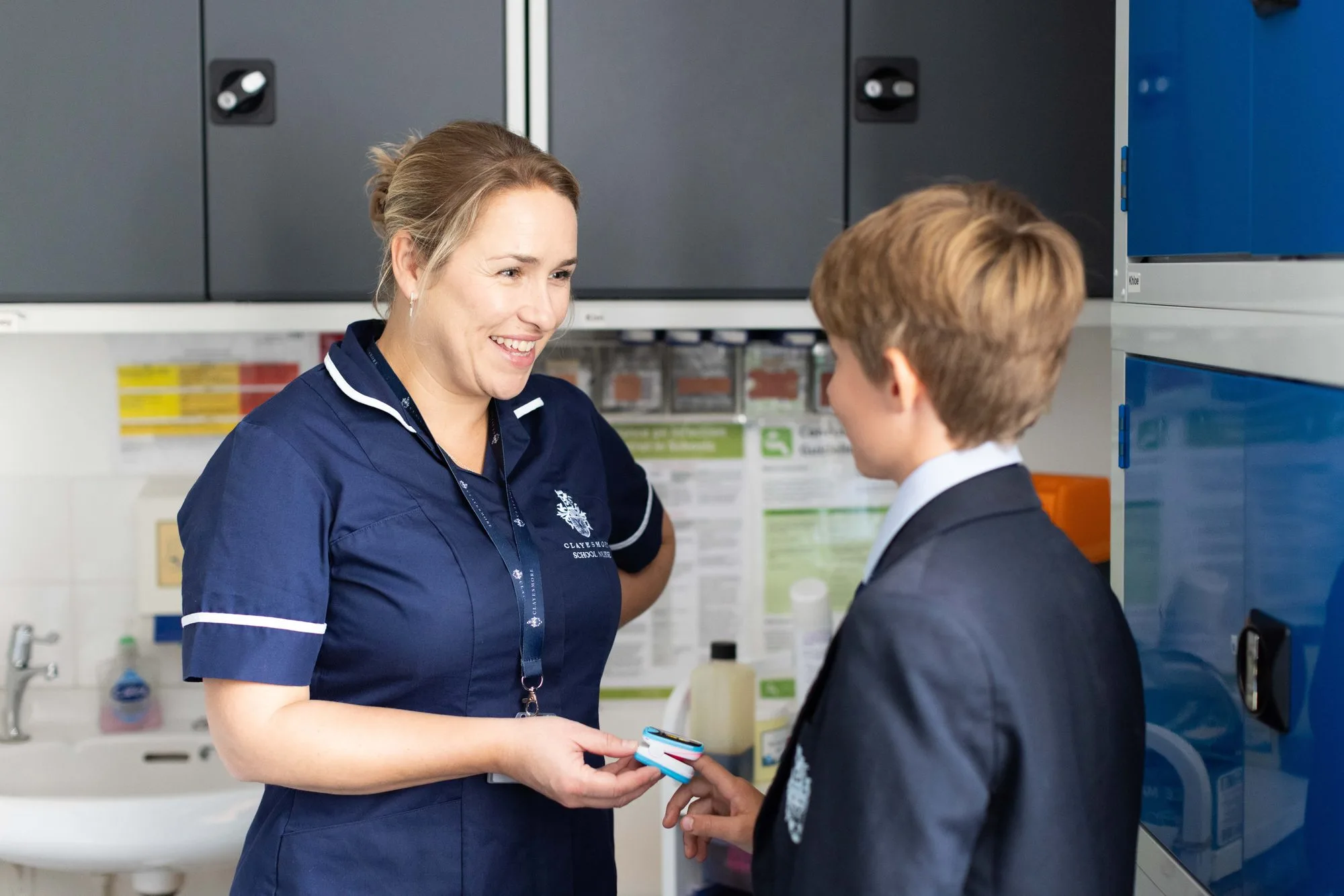 A nurse helping a pupil in the Medical Centre