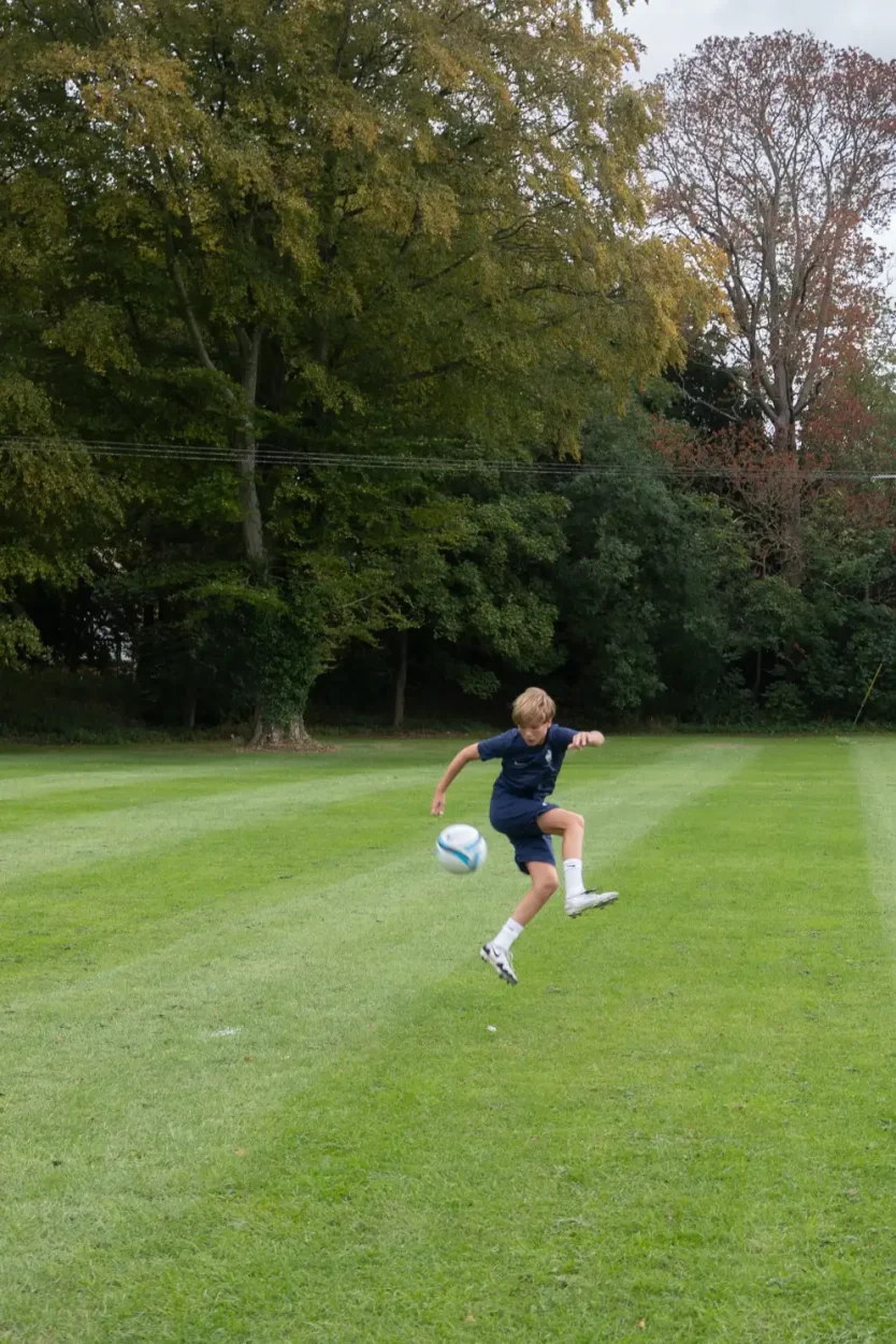 kicking a football